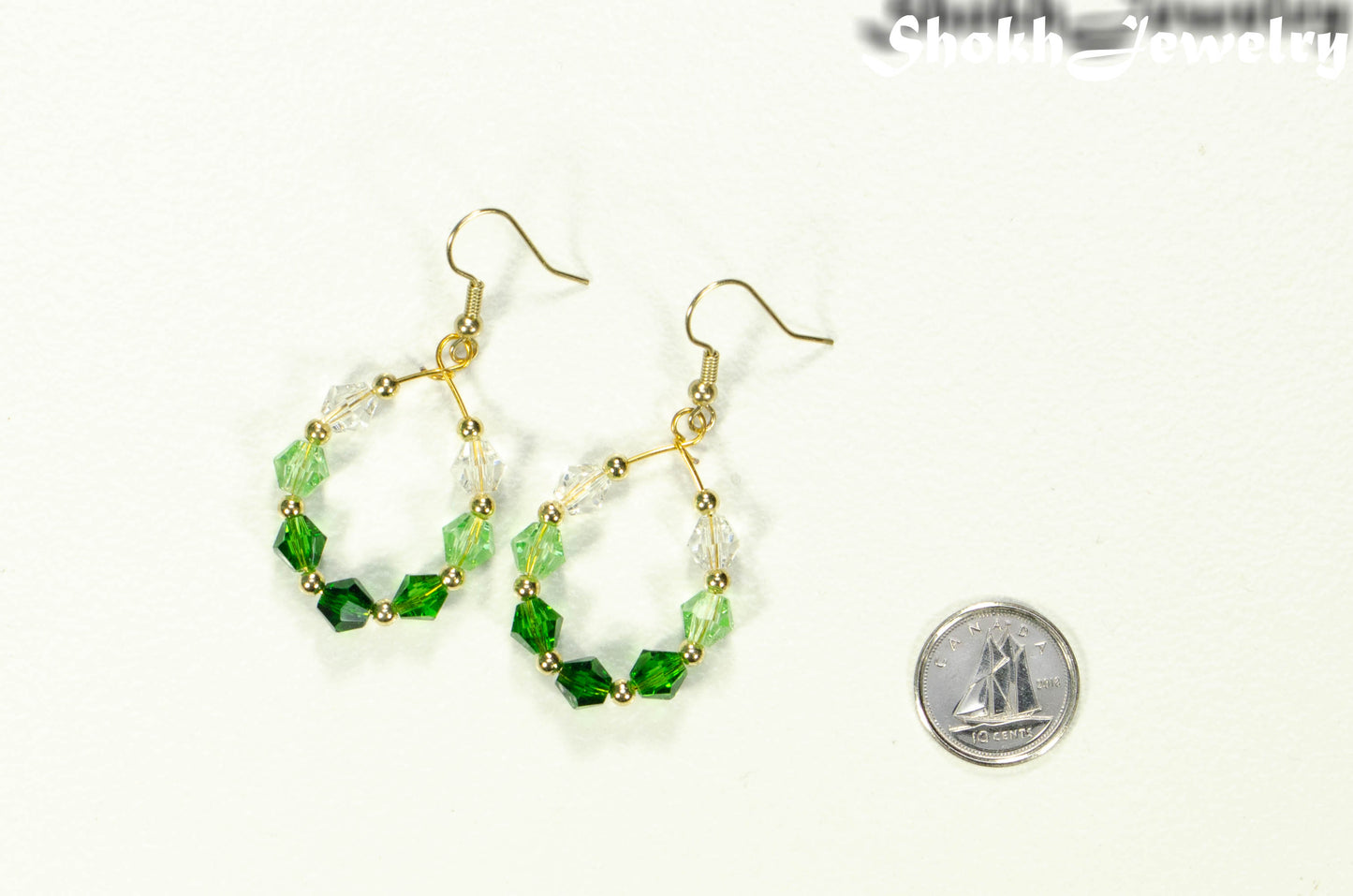 Ombre Green Glass Crystal Hoop Earrings beside a dime.