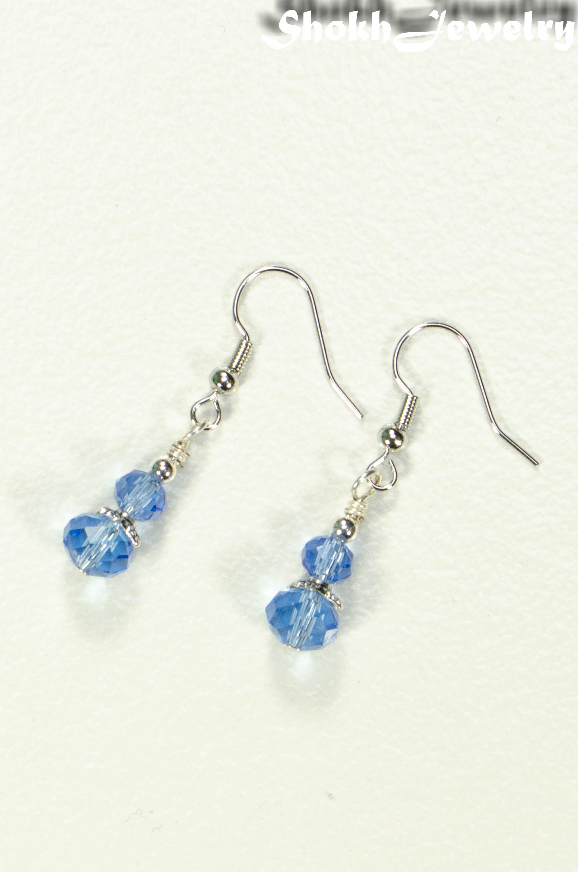 Top view of Small Light Blue Glass Bead Dangle Earrings.