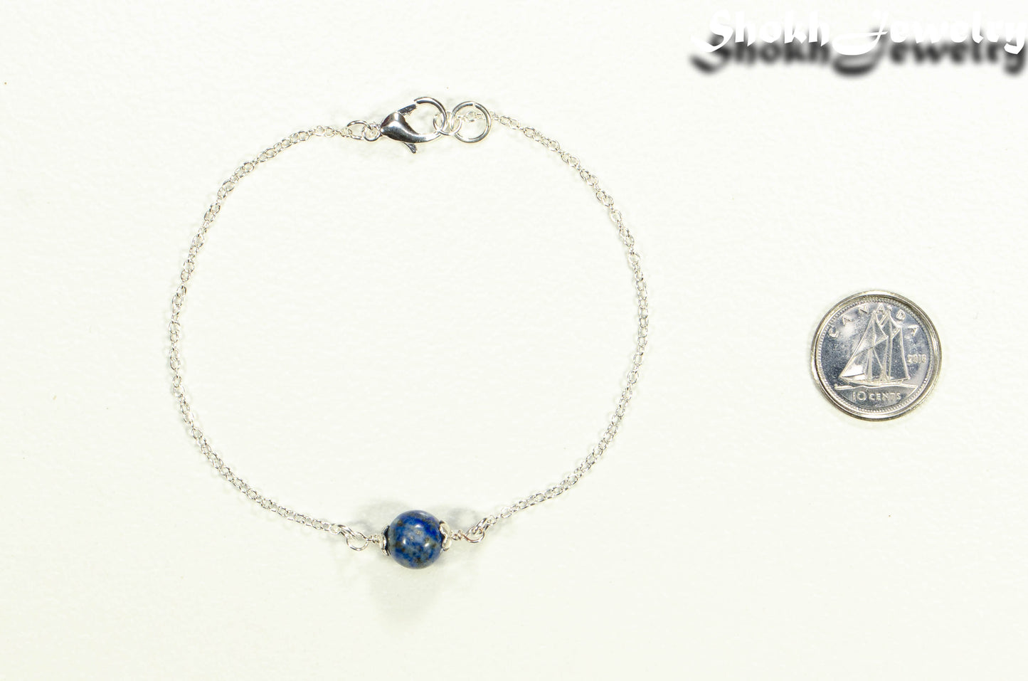 Minimal Lapis Lazuli Bracelet beside a dime.