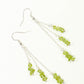 Top view of Long Silver Plated Chain and Peridot Chip Earrings