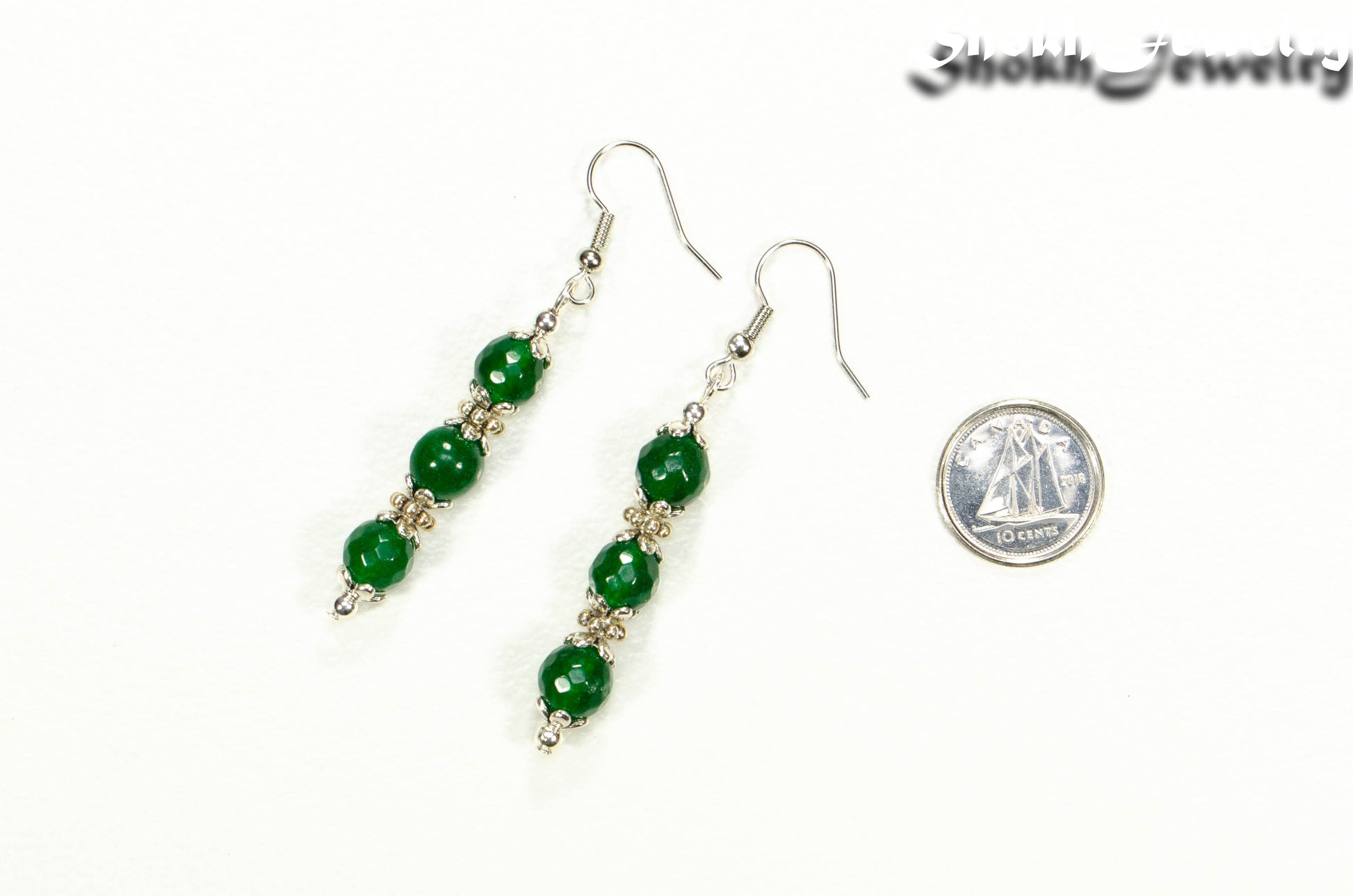 Natural Emerald Beaded Bar Earrings beside a dime.