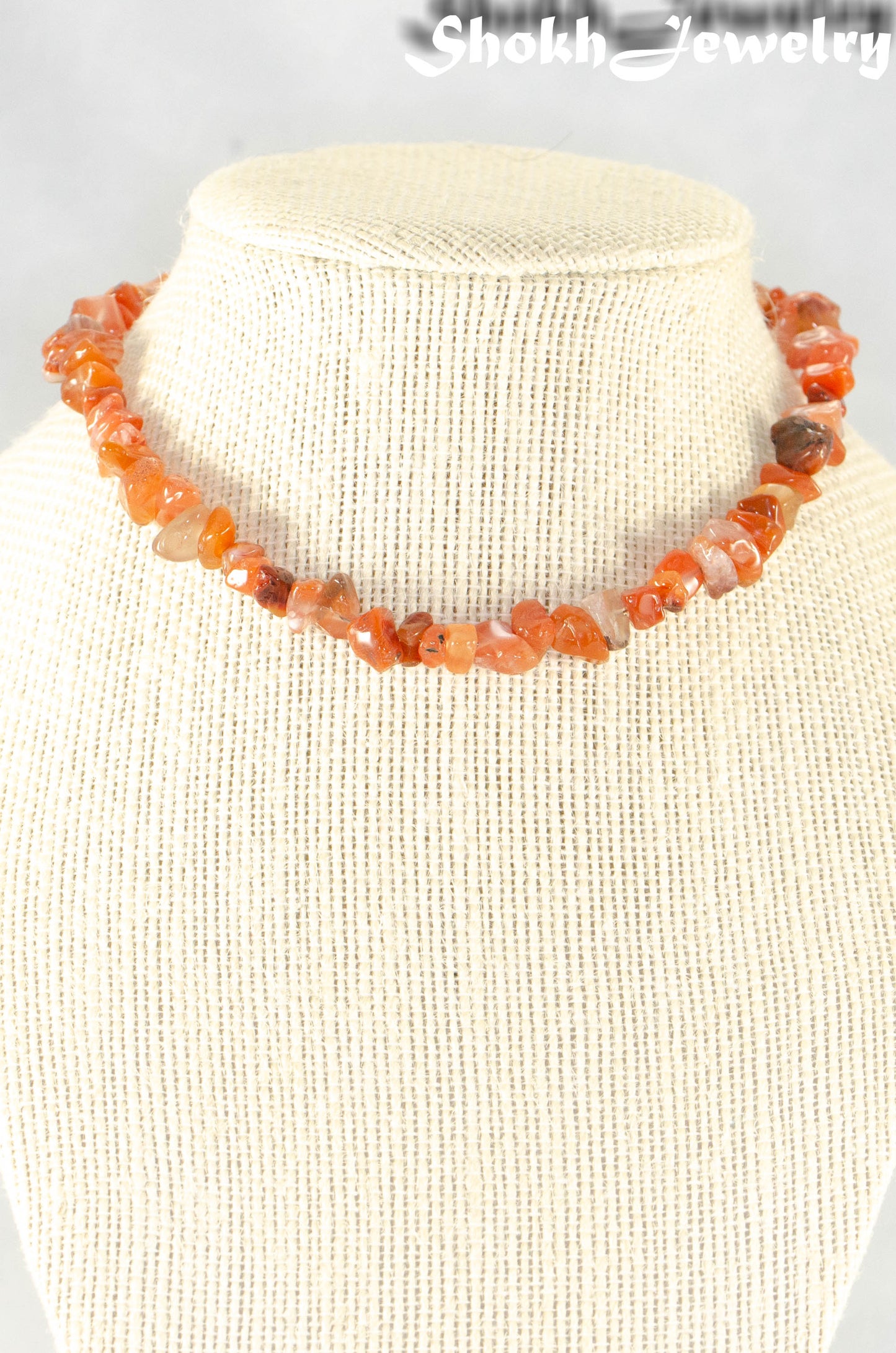 Natural Carnelian Crystal Chip Choker Necklace displayed on a bust.