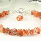 Close up of Natural Carnelian Crystal Chip Bracelet.