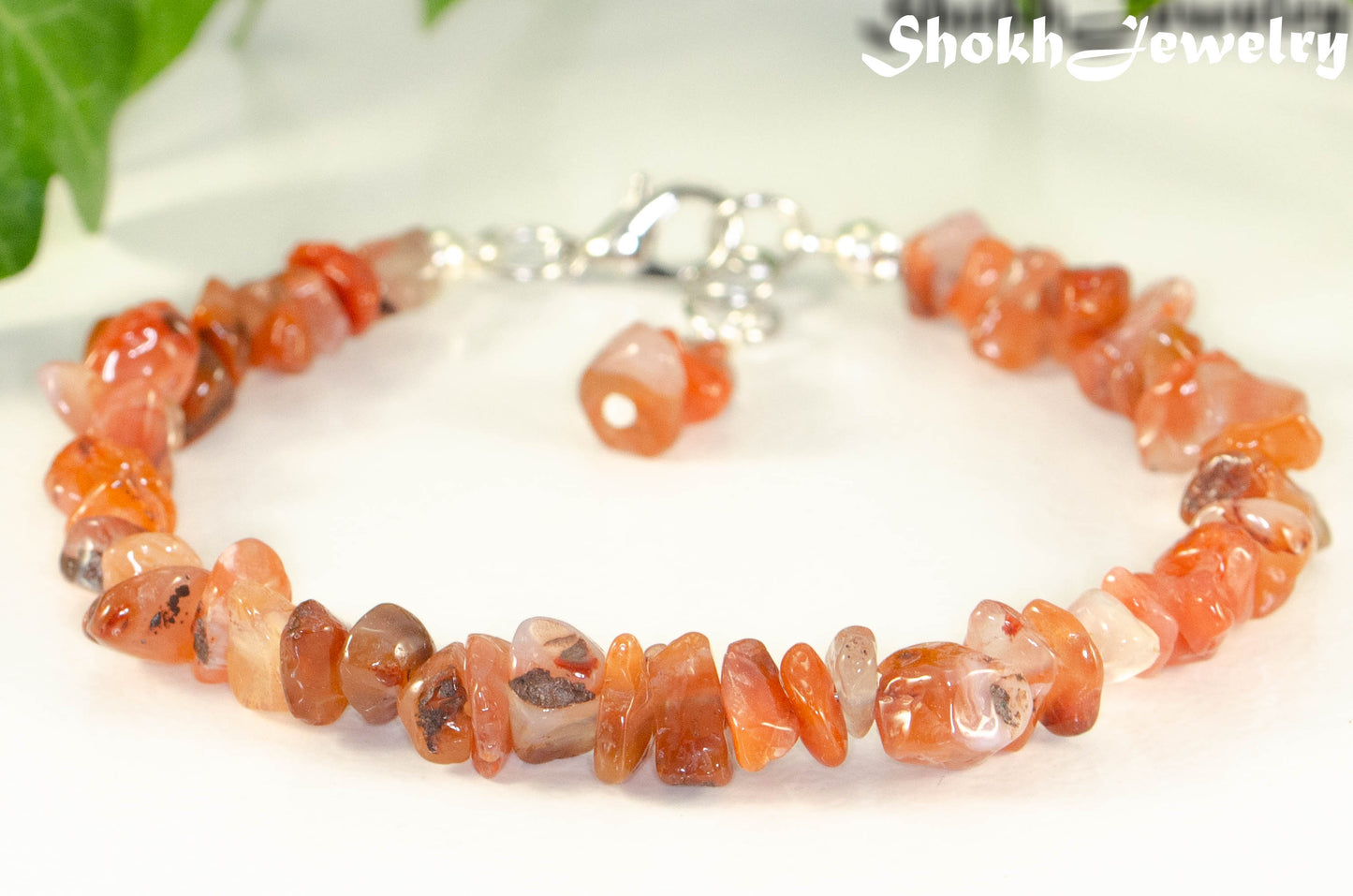 Close up of Natural Carnelian Crystal Chip Bracelet.