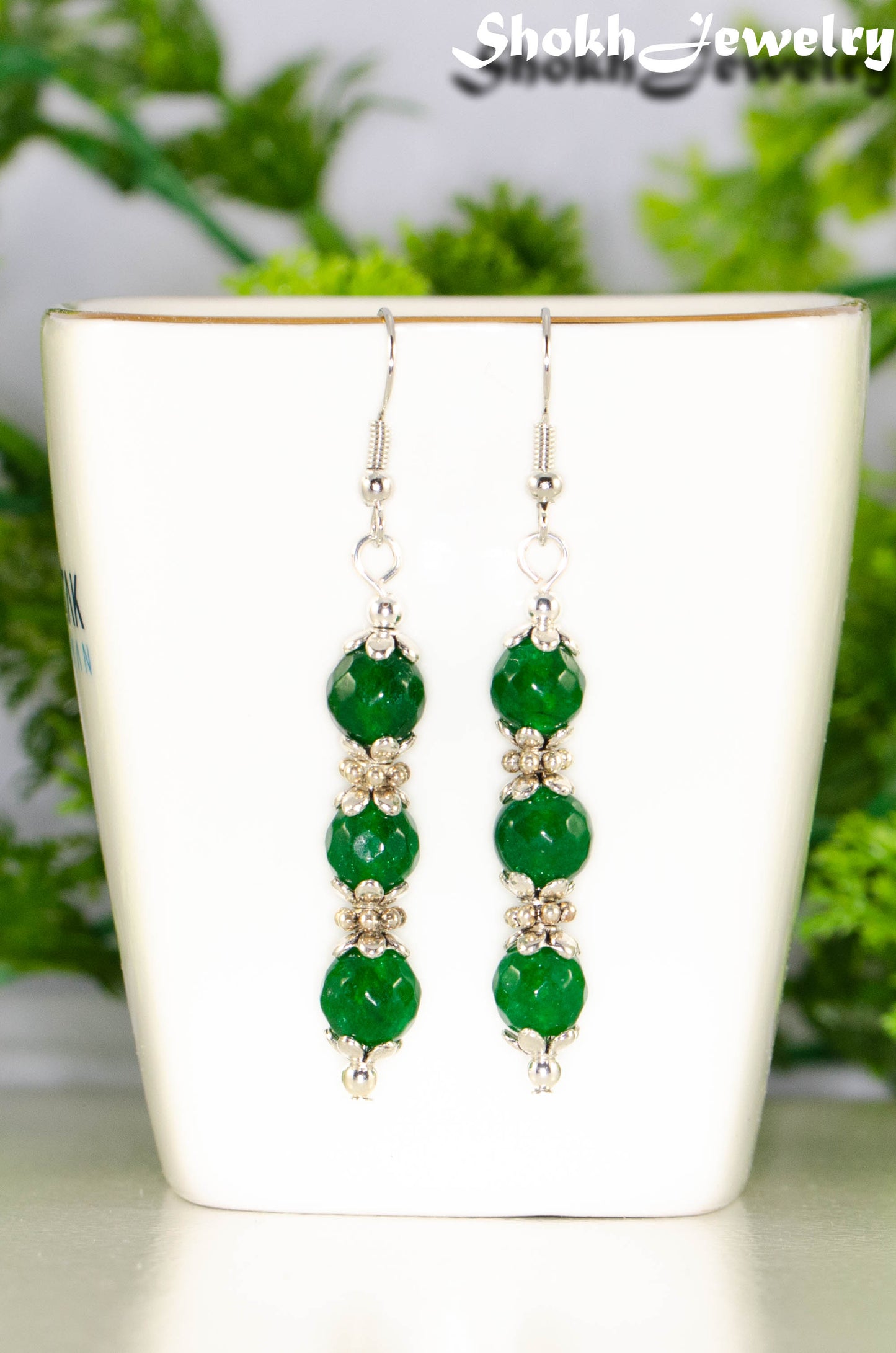 Close up of Natural Emerald Beaded Bar Earrings.