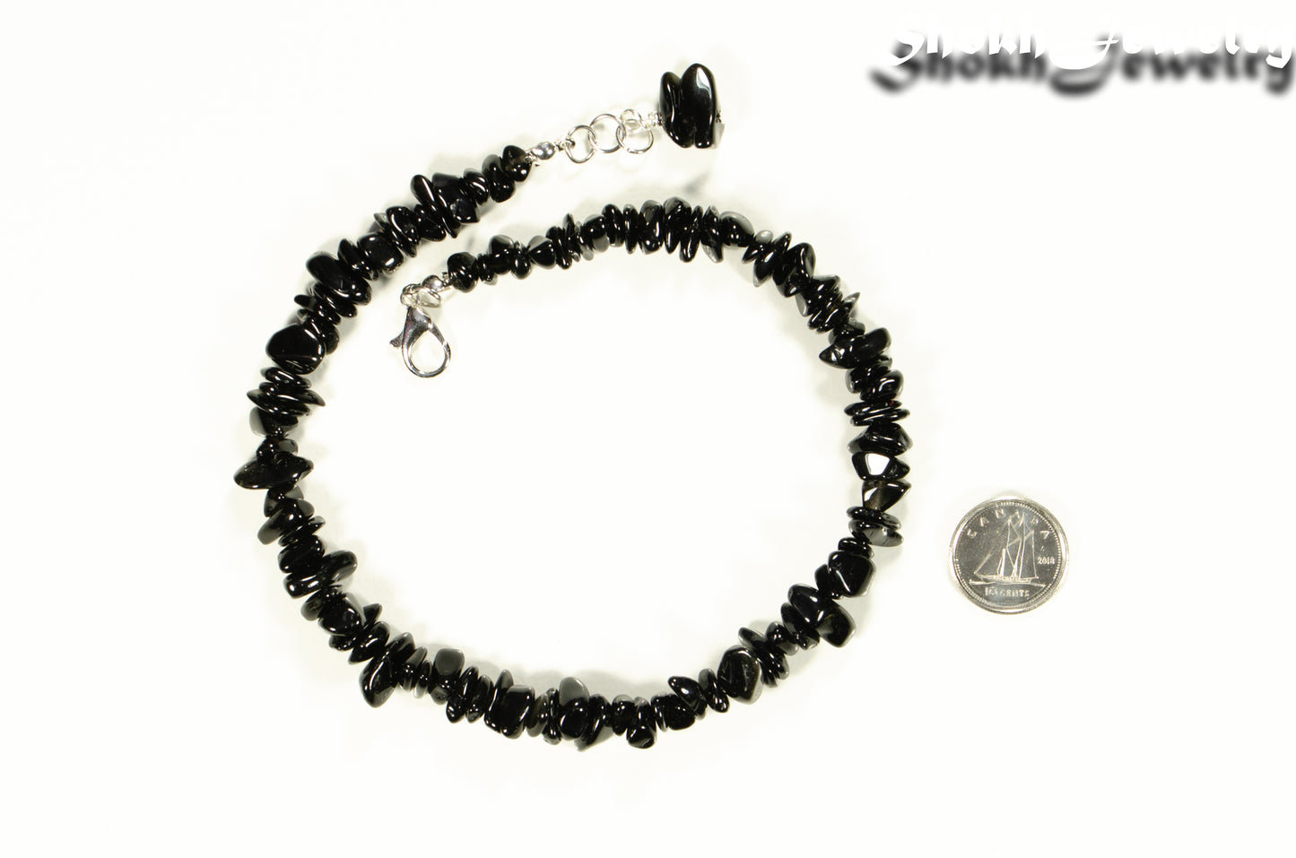 Natural Black Obsidian Crystal Chip Choker Necklace beside a dime.