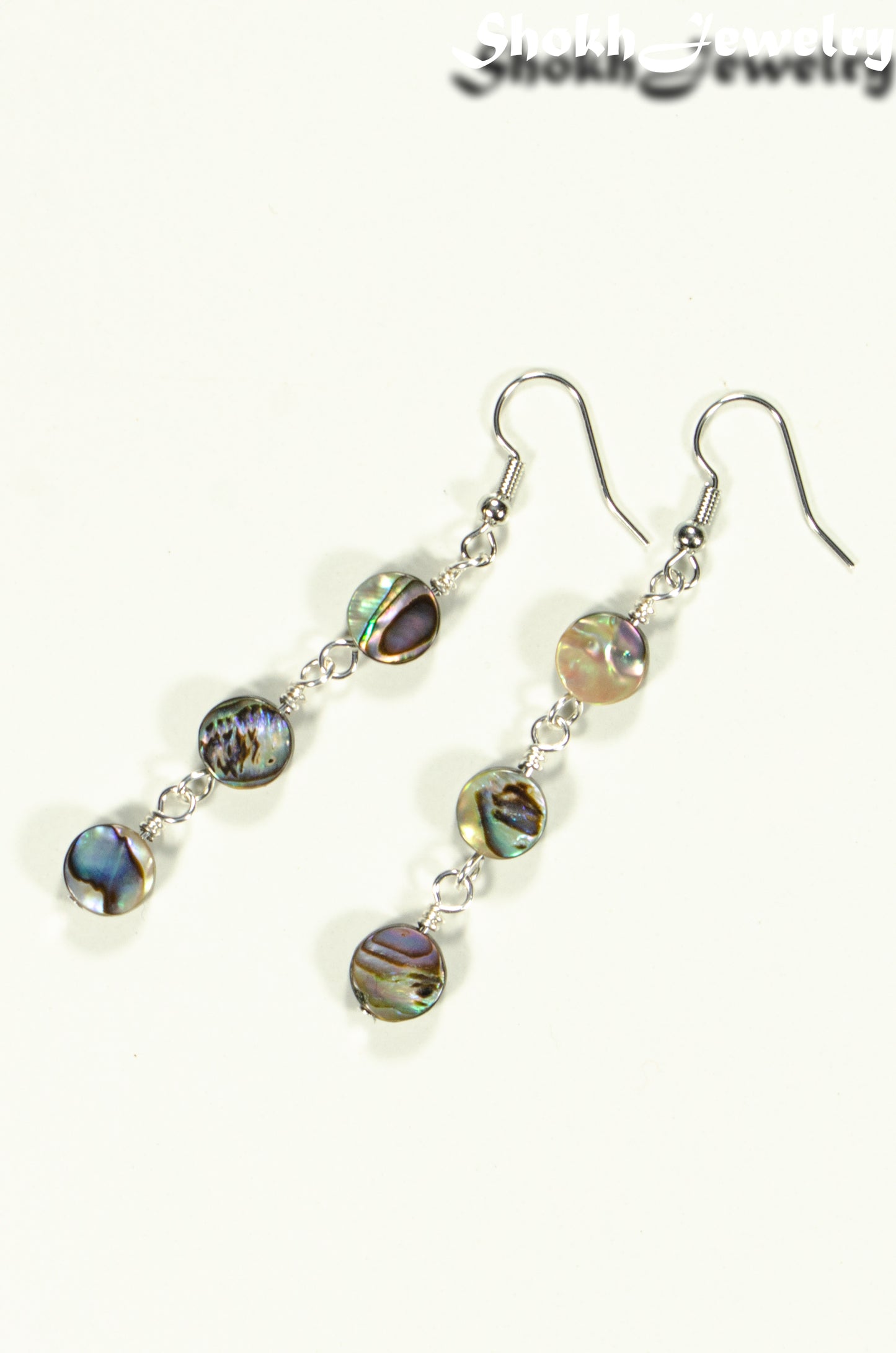 Top view of Elegant Long Natural Abalone Shell Earrings.