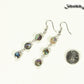 Elegant Long Natural Abalone Shell Earrings beside a dime.