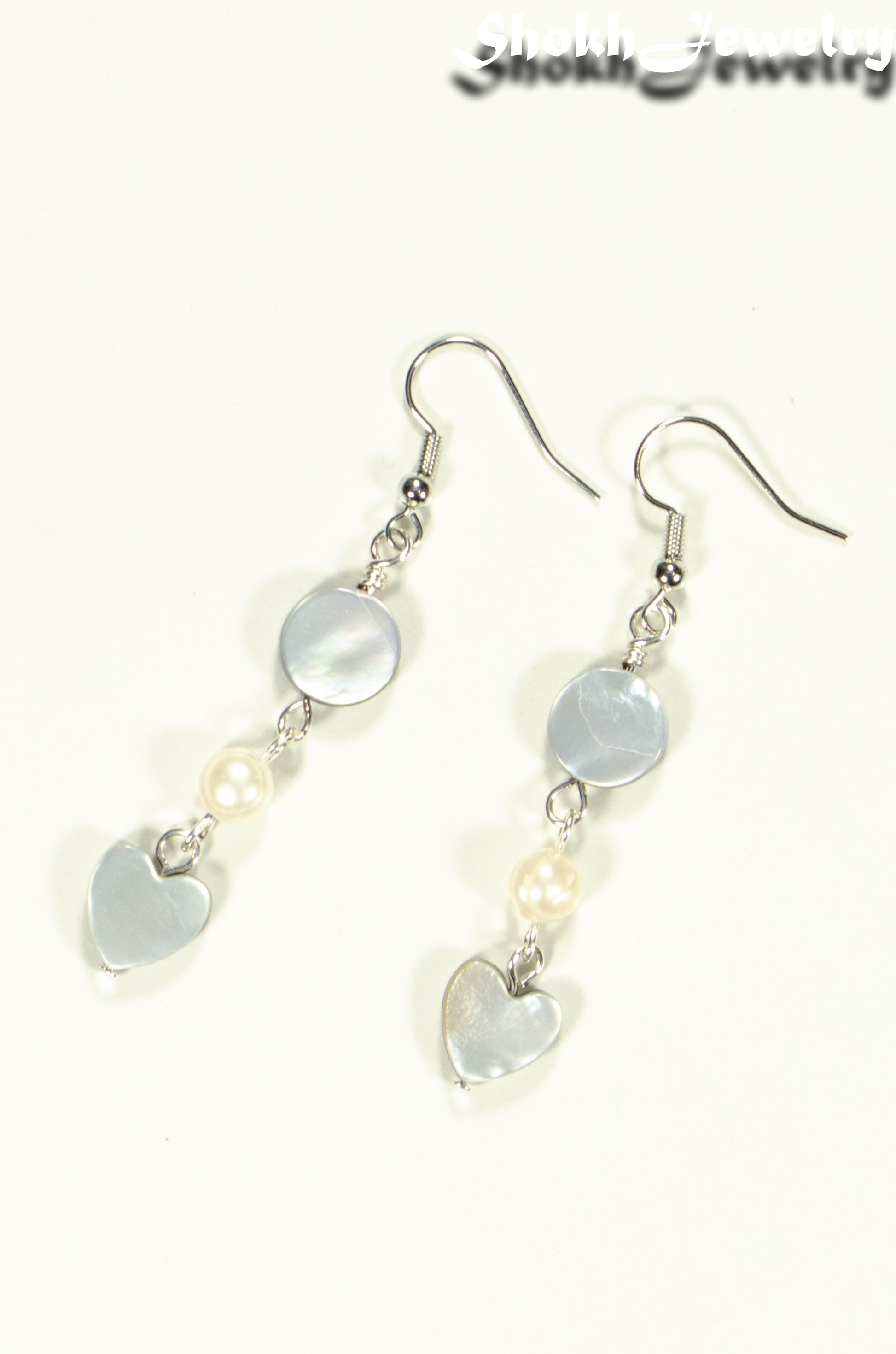 Top view of Grey Seashell and White Pearl Earrings.