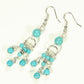 Top view of Statement Turquoise Howlite Chandelier Earrings.