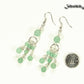 Statement Green Aventurine Crystal Chandelier Earrings beside a dime.
