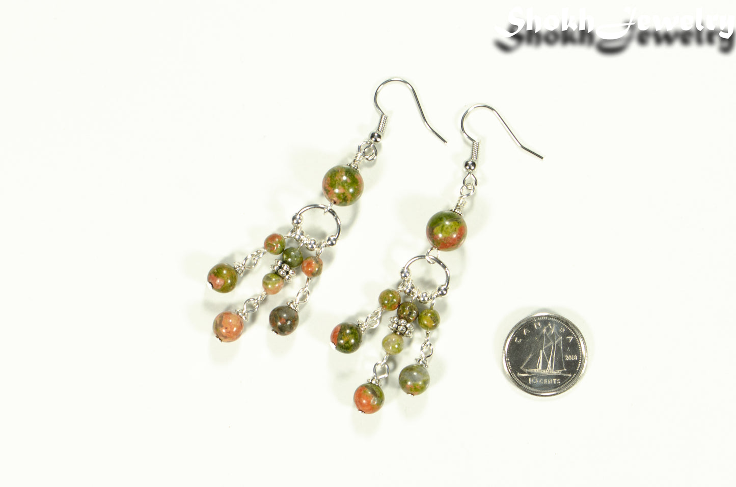 Statement Unakite Jasper Chandelier Earrings beside a dime.