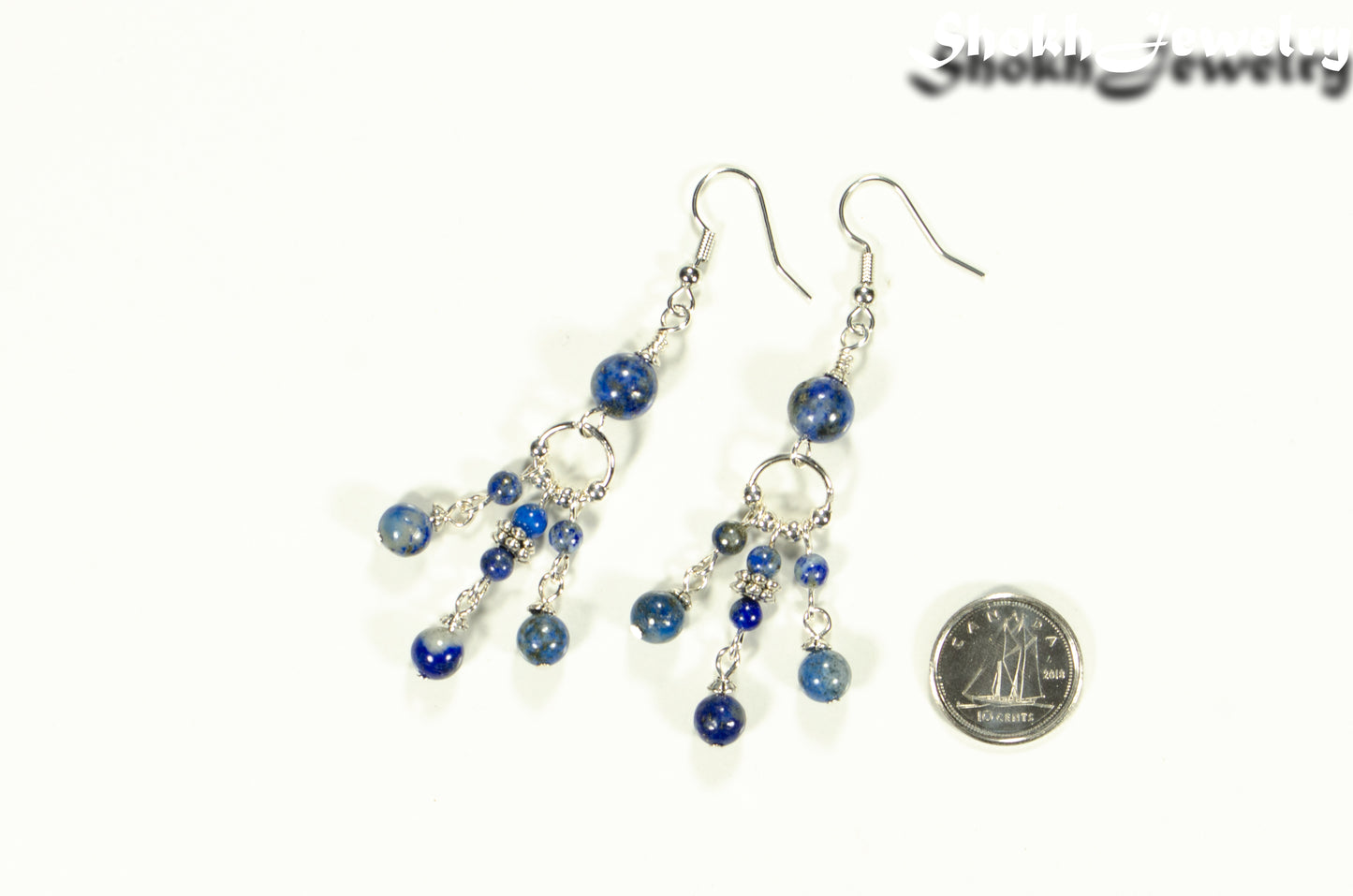 Statement Lapis Lazuli Chandelier Earrings beside a dime.