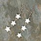 Top view of Long Natural White Seashell Star Earrings.