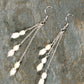 Top view of Long Silver Plated Chain and Freshwater Pearl Earrings.