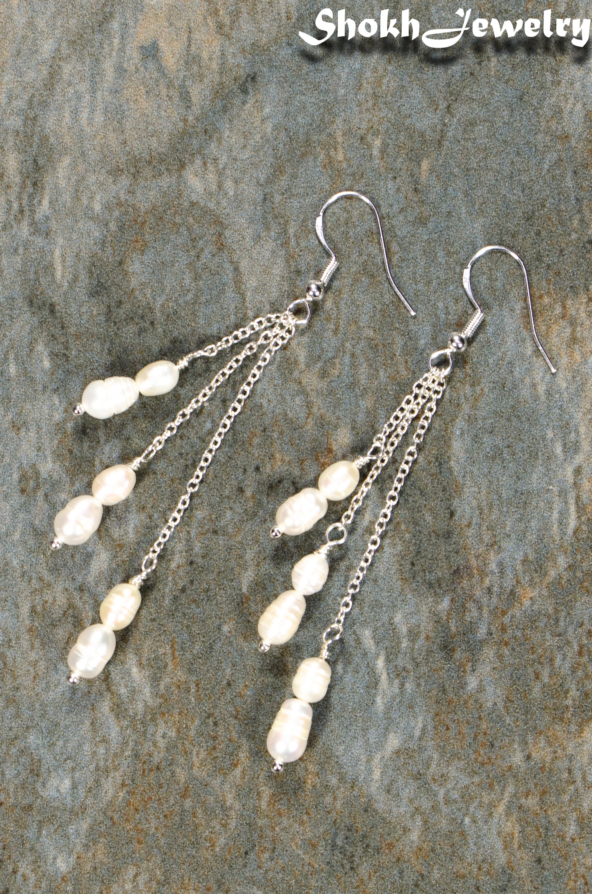 Top view of Long Silver Plated Chain and Freshwater Pearl Earrings.