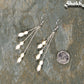 Long Silver Plated Chain and Freshwater Pearl Earrings beside a dime.