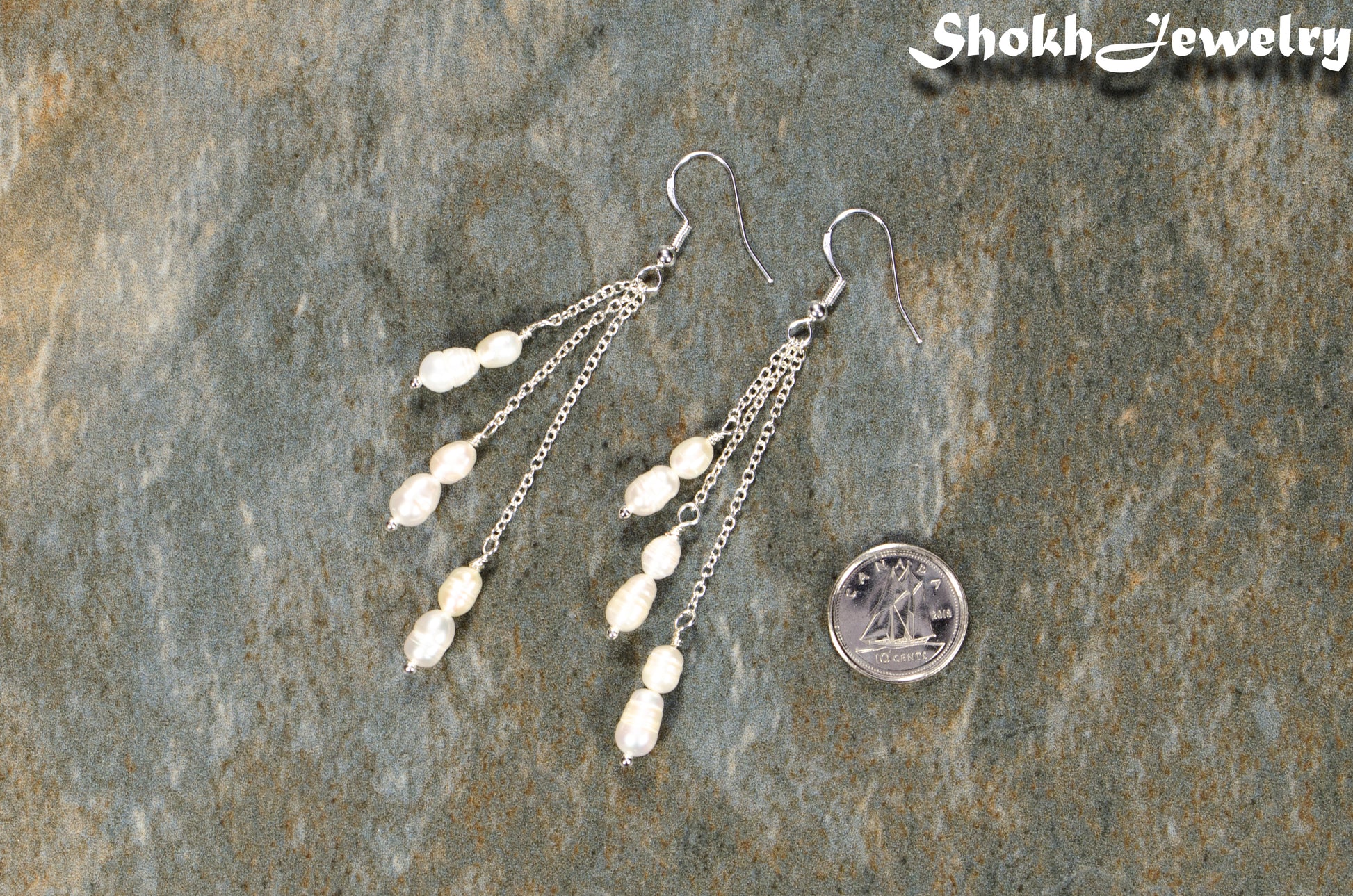 Long Silver Plated Chain and Freshwater Pearl Earrings beside a dime.