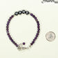 Personalized Amethyst Name Bracelet with Clasp beside a dime.