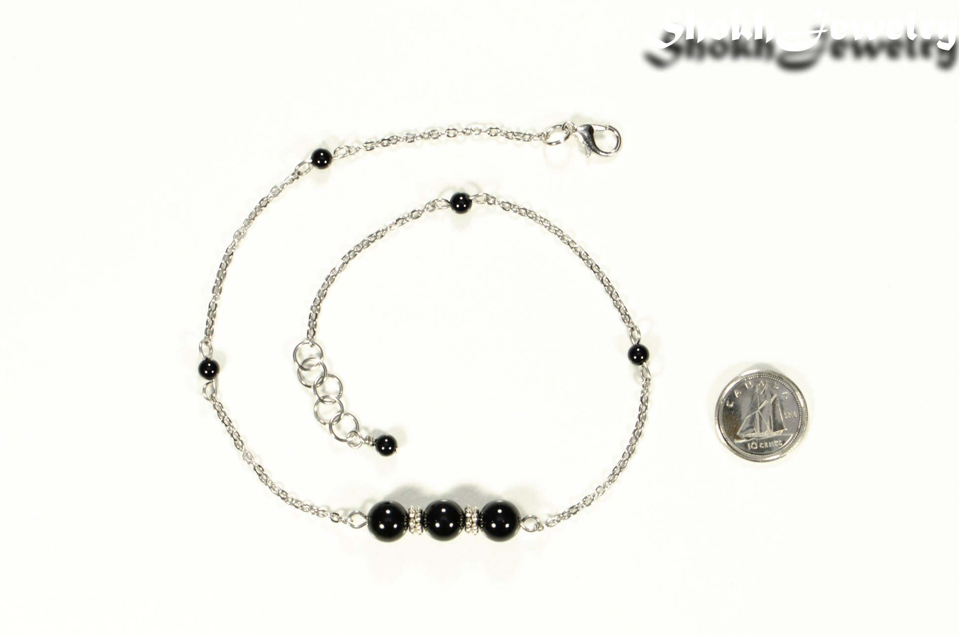Natural Black Onyx and Chain Choker Necklace beside a dime.