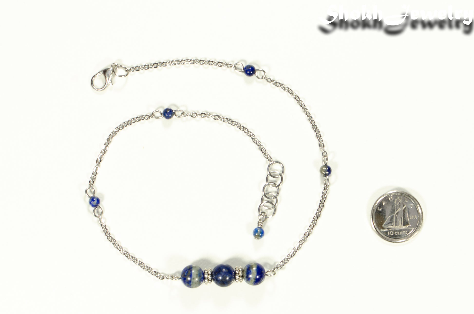 Natural Lapis Lazuli and Chain Choker Necklace beside a dime.