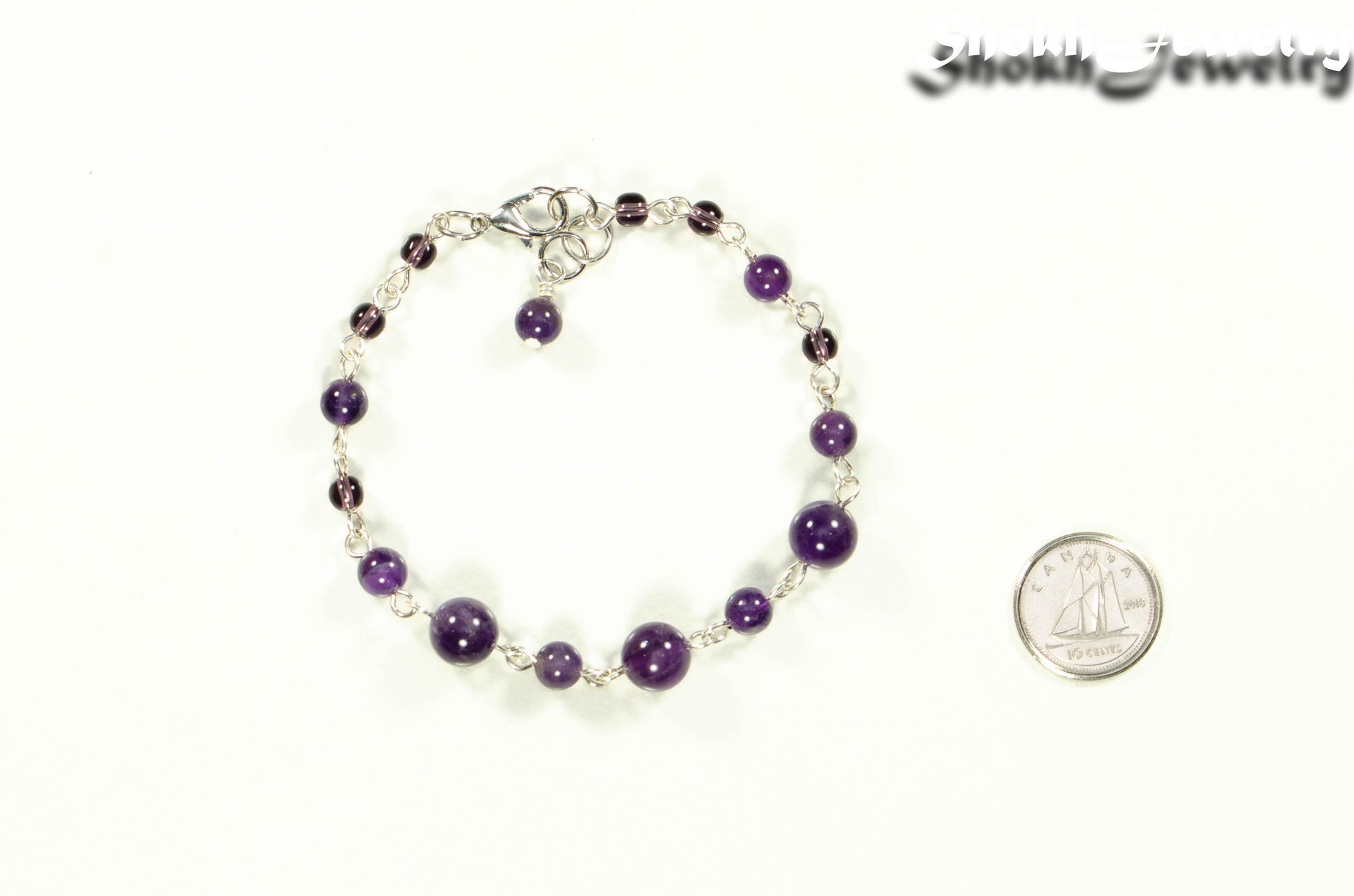 Handmade Amethyst Link Chain Bracelet beside a dime.