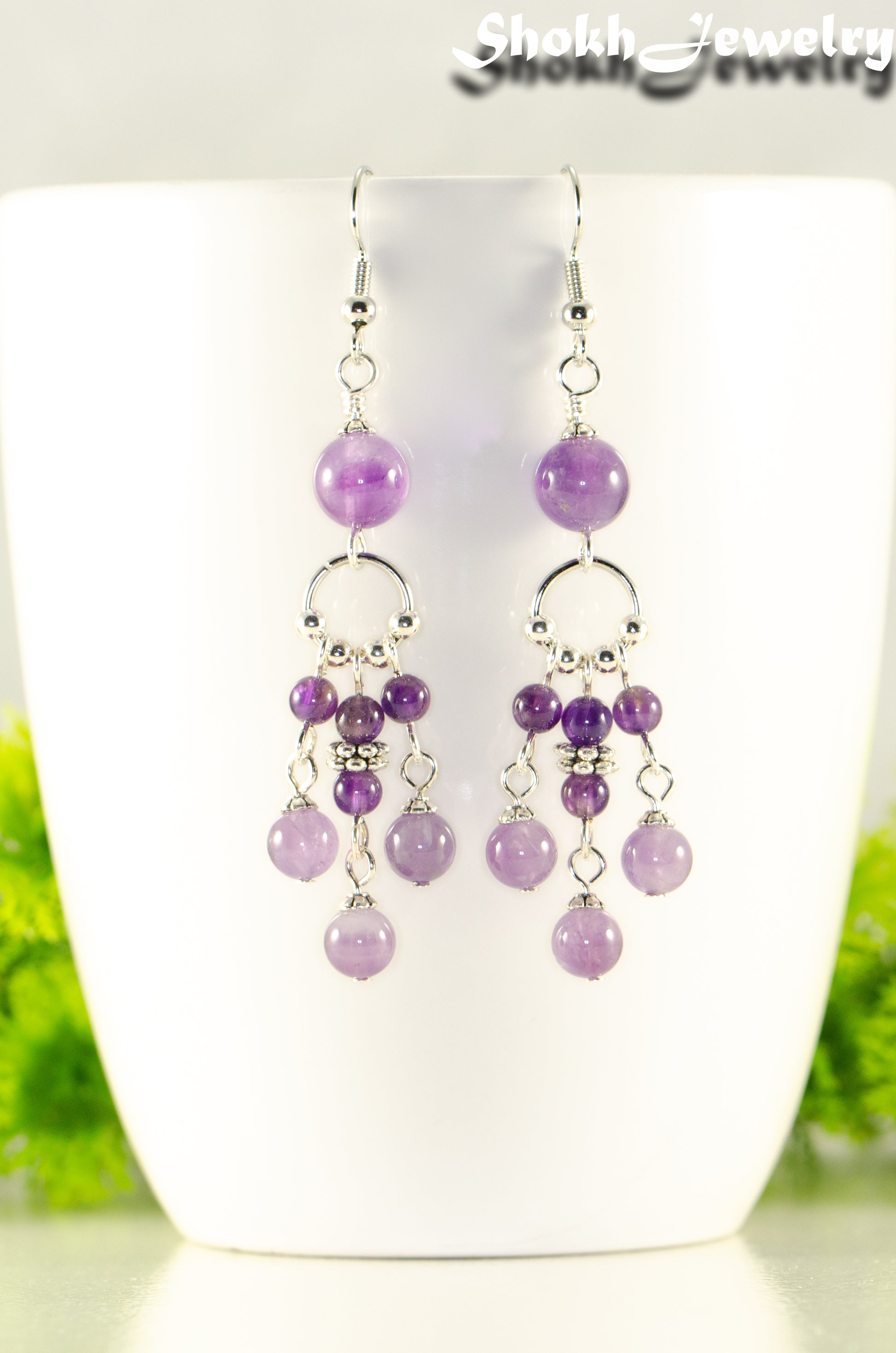 Close up of Statement Amethyst Crystal Chandelier Earrings.