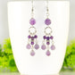 Statement Amethyst Crystal Chandelier Earrings displayed on a coffee mug.