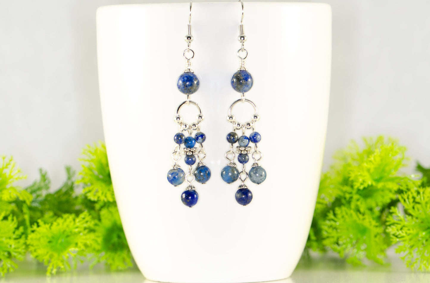 Statement Lapis Lazuli Chandelier Earrings displayed on a coffee mug.