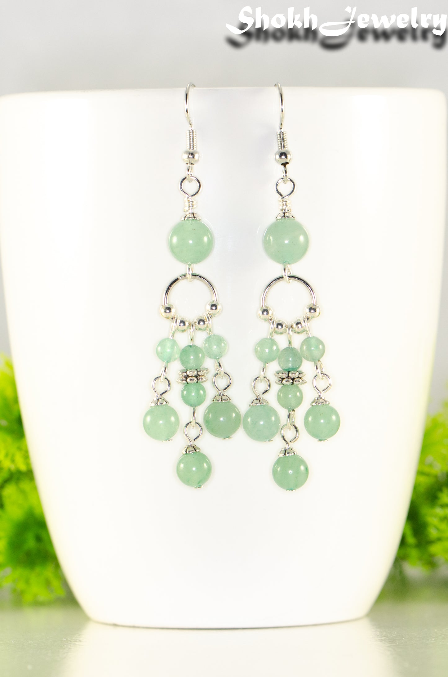 Close up of Statement Green Aventurine Crystal Chandelier Earrings.