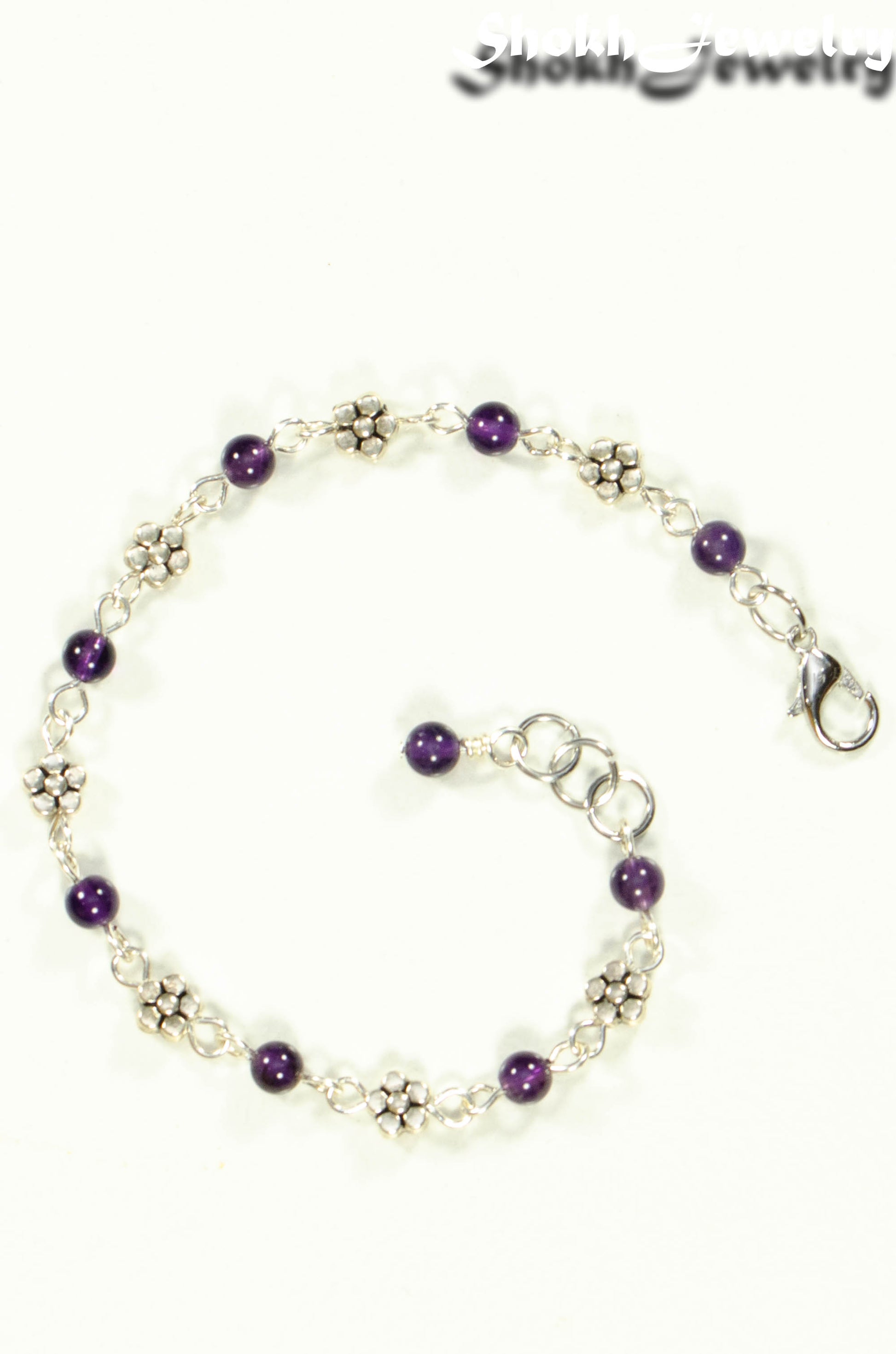 Top view of Tibetan Silver Flower and Amethyst Link Bracelet.