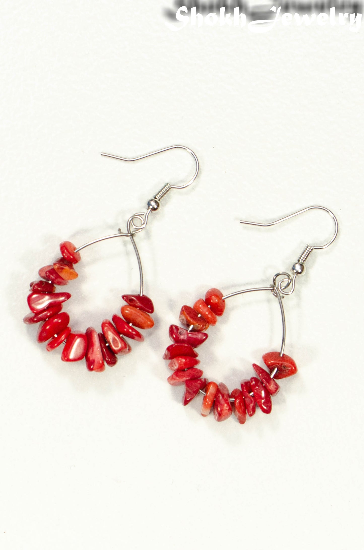 Top view of Natural Red Coral Crystal Chip Earrings.