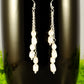 Close up of Long Silver Plated Chain and Freshwater Pearl Earrings.