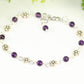 Close up of Tibetan Silver Flower and Amethyst Link Bracelet.