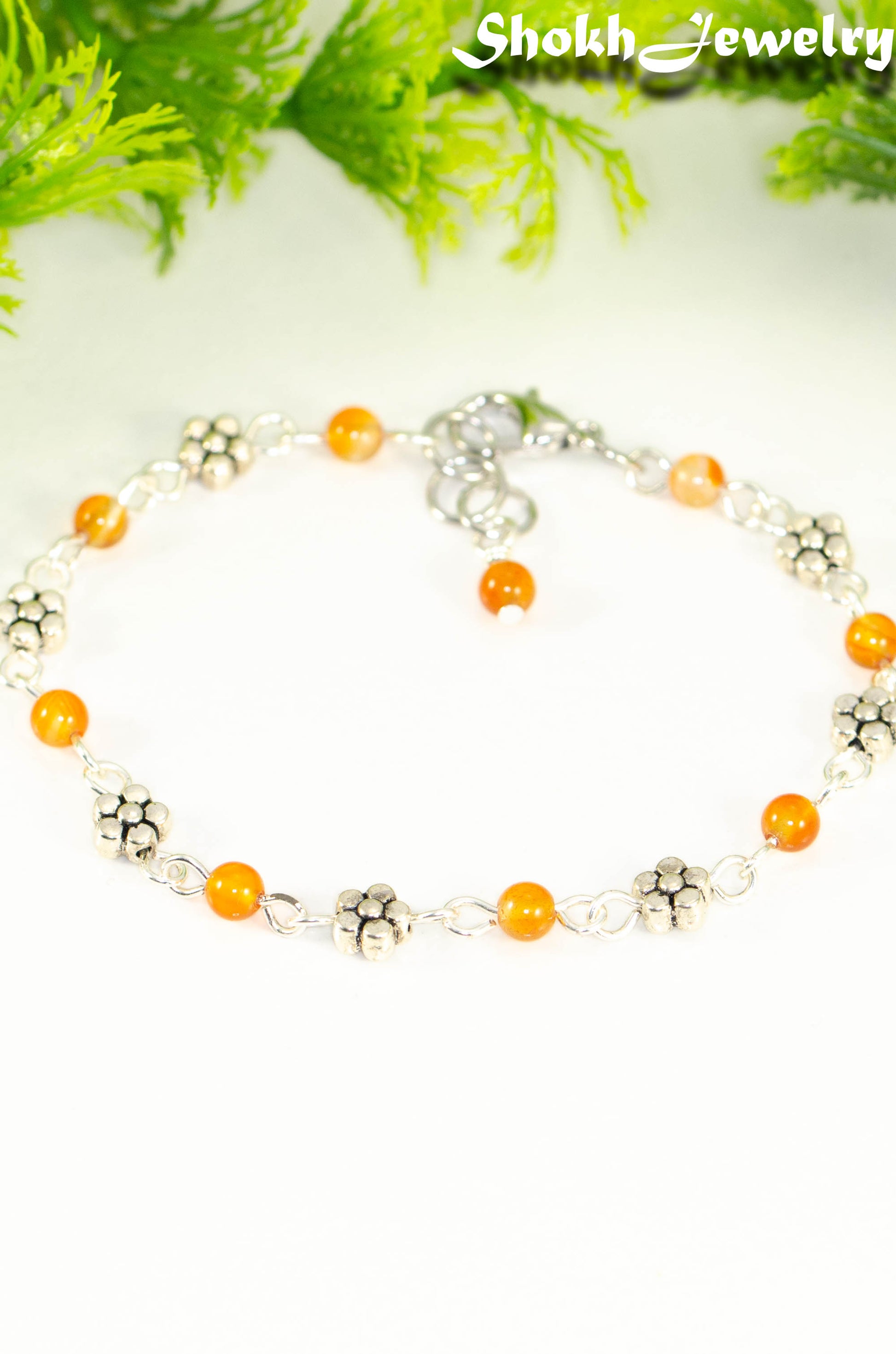 Close up of Tibetan Silver Flower and Carnelian Link Bracelet.