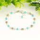 Tibetan Silver Flower and Turquoise Howlite Link Bracelet with lobster claw clasp closure.