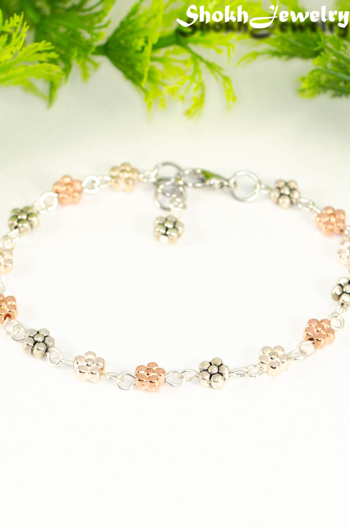 Close up of Multi Metal Flower Link Bracelet.