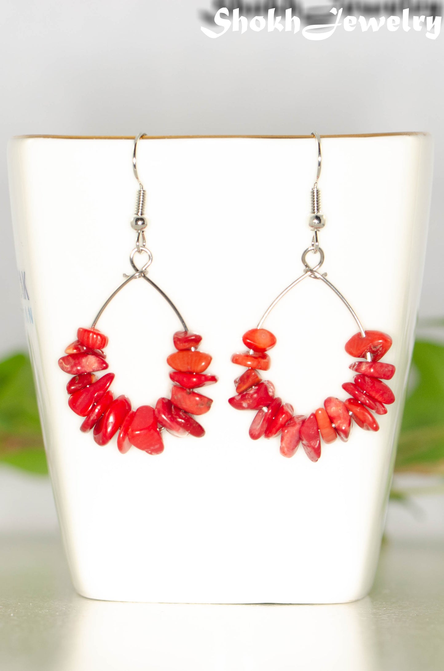 Close up of Natural Red Coral Crystal Chip Earrings.