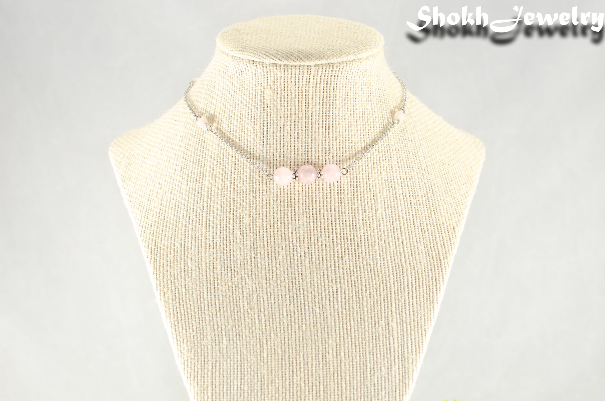 Natural Rose Quartz and Chain Choker Necklace displayed on a bust.