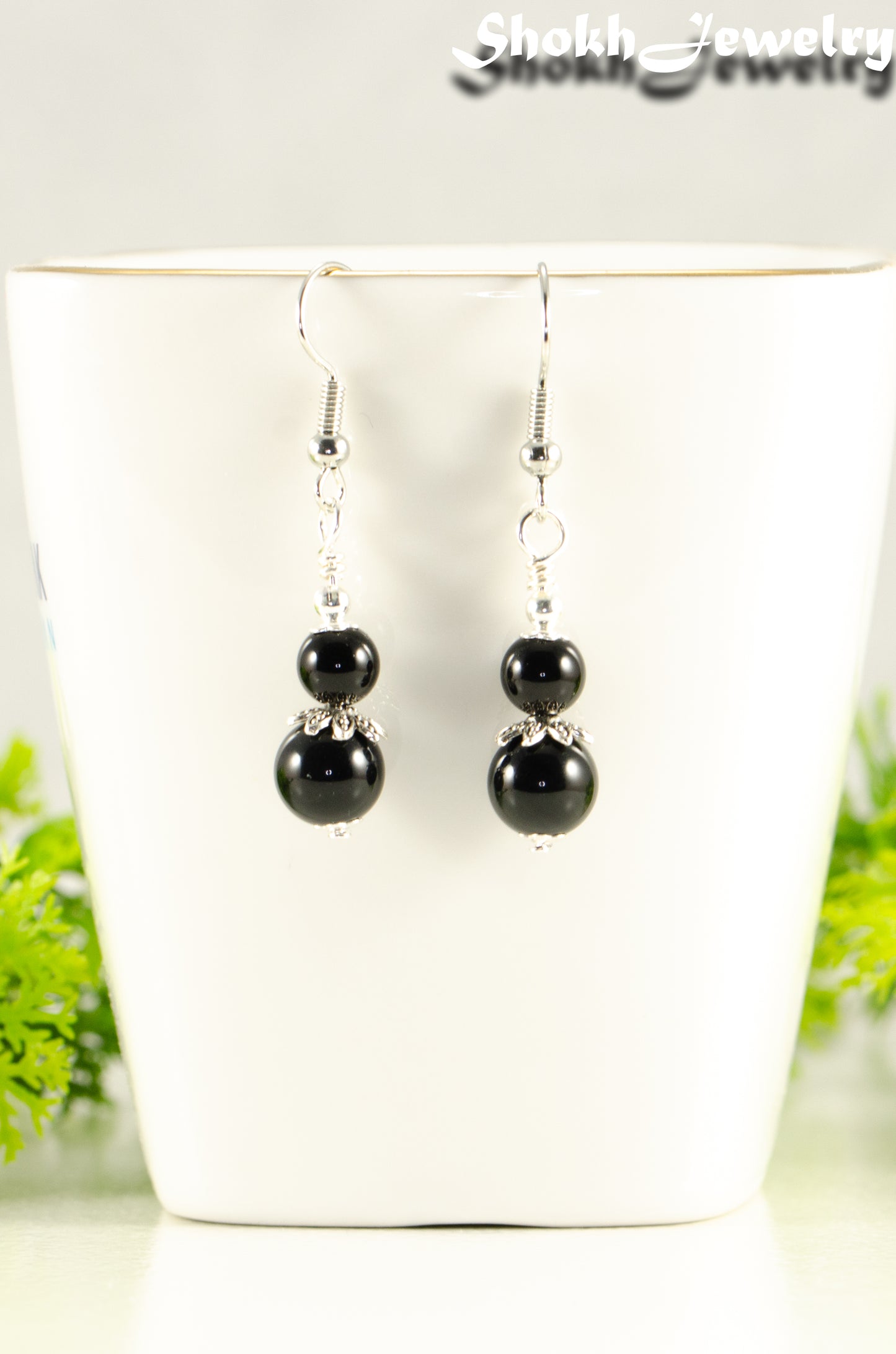 Close up of Small Black Tourmaline Earrings.