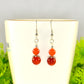 Close up of Small Natural Fire Agate Earrings.
