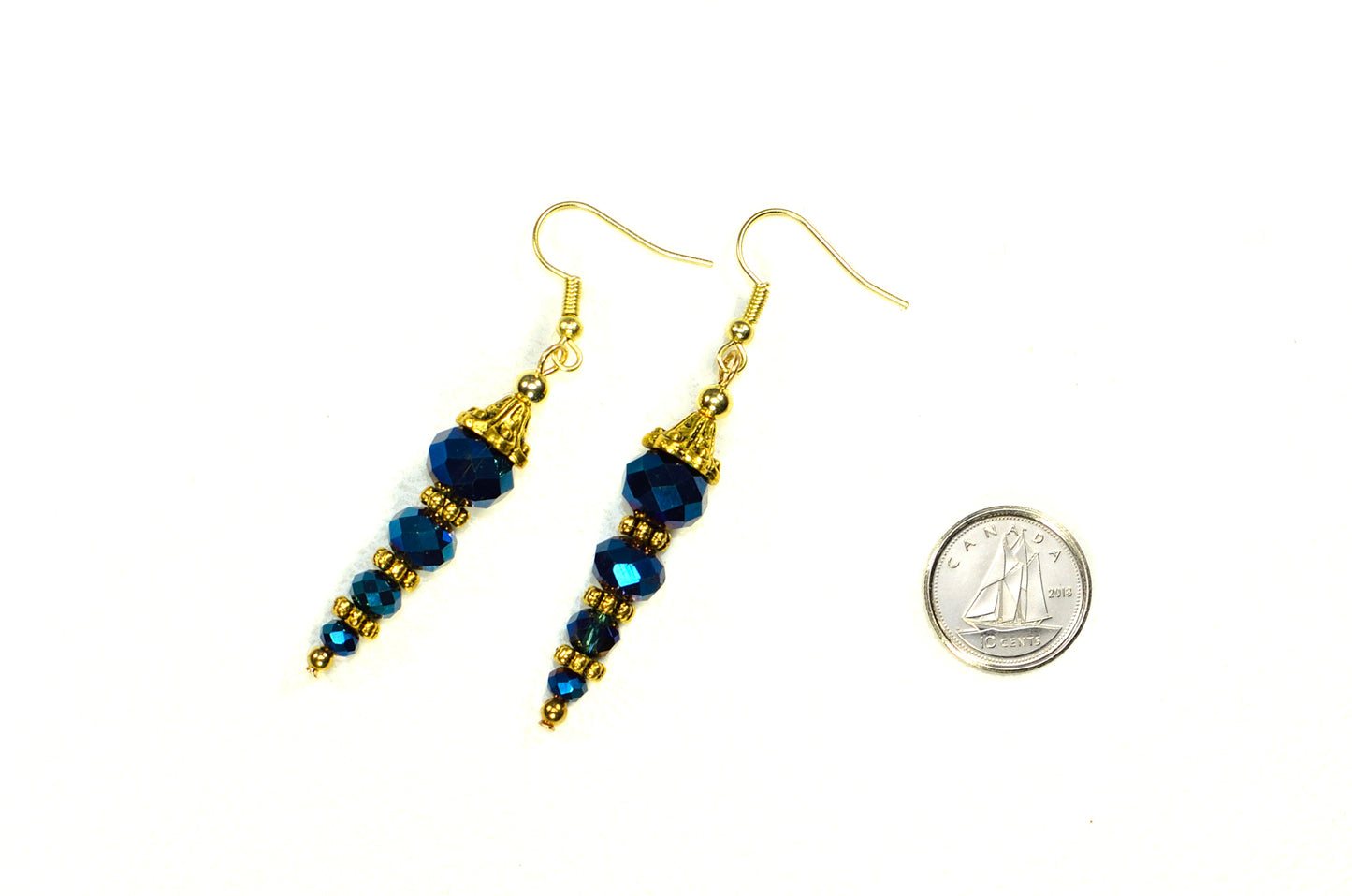 Sparkly Blue Glass Crystal Bead Earrings beside a dime.