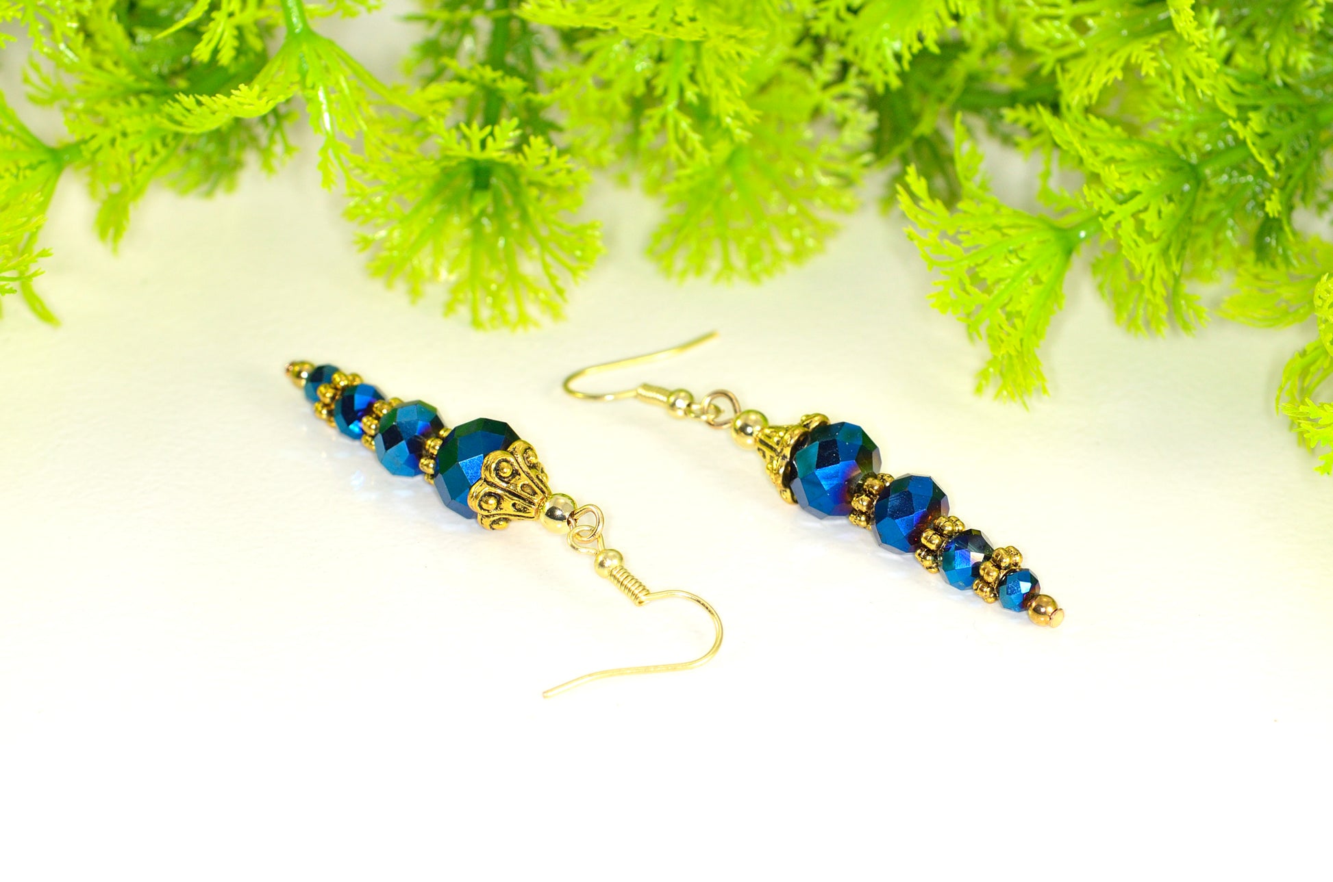 Close up of Sparkly Blue Glass Crystal Bead Earrings.