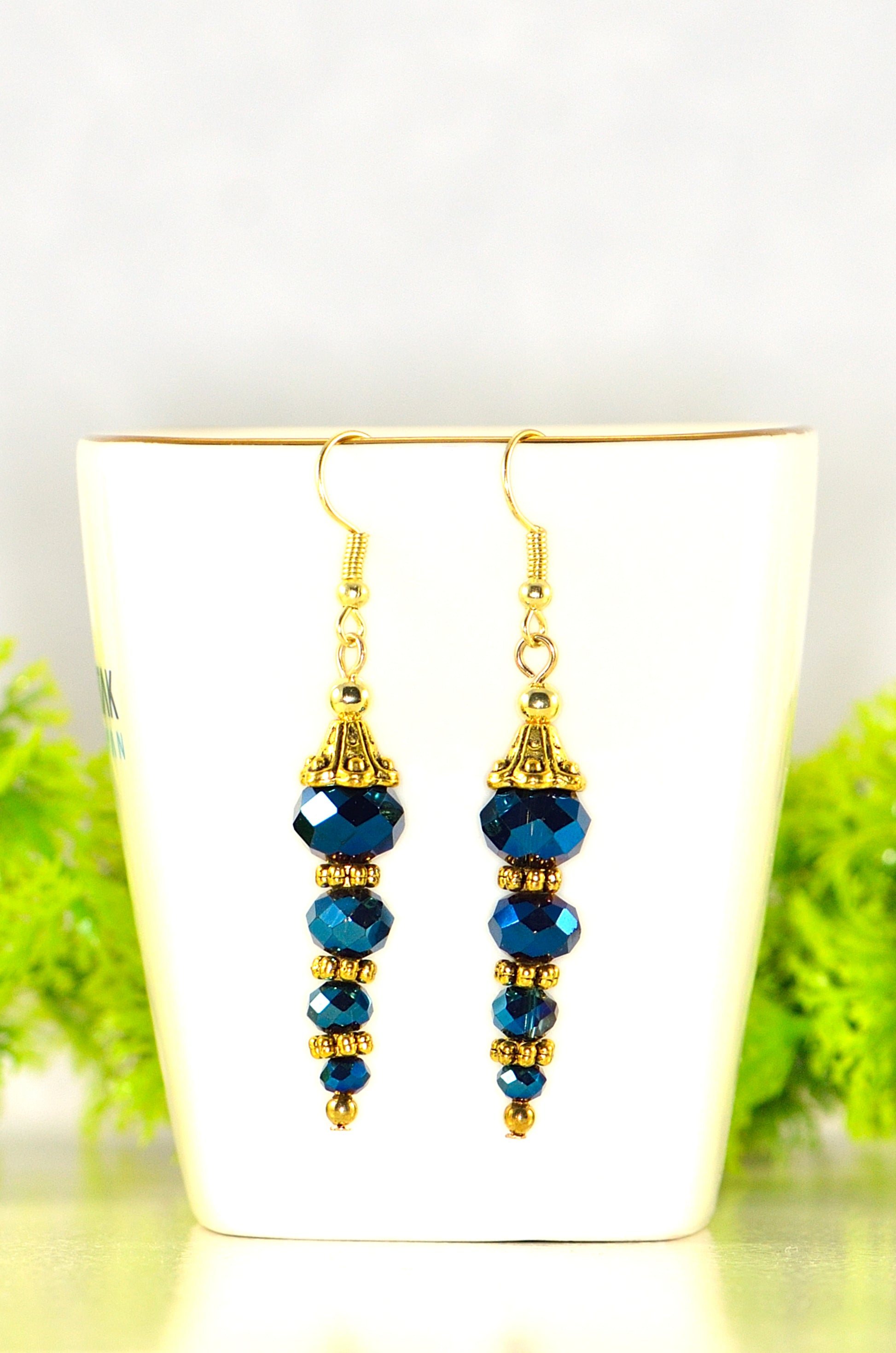 Close up of Sparkly Blue Glass Crystal Bead Earrings.