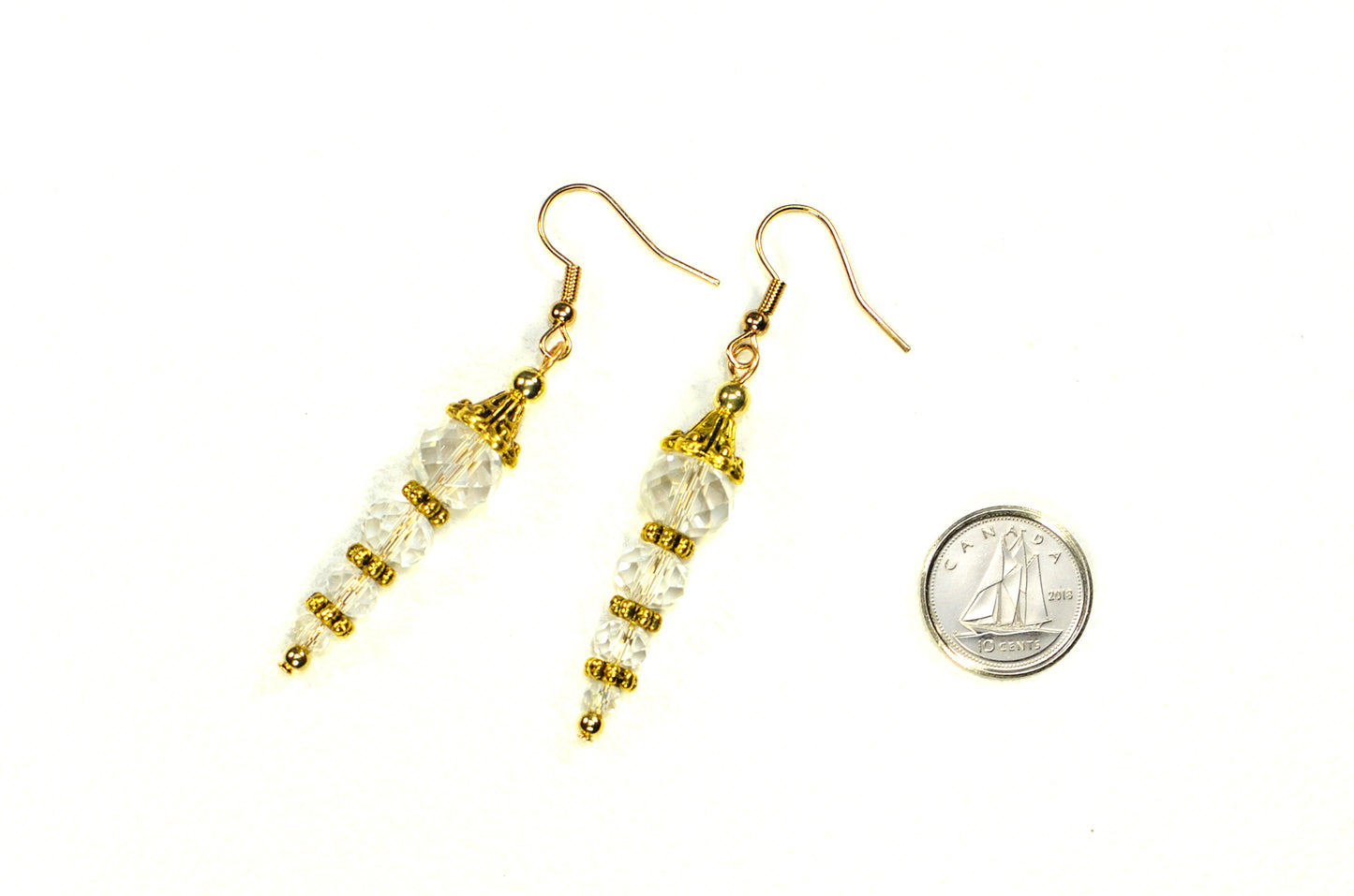 Sparkly Crystal Clear Glass Bead Earrings beside a dime.