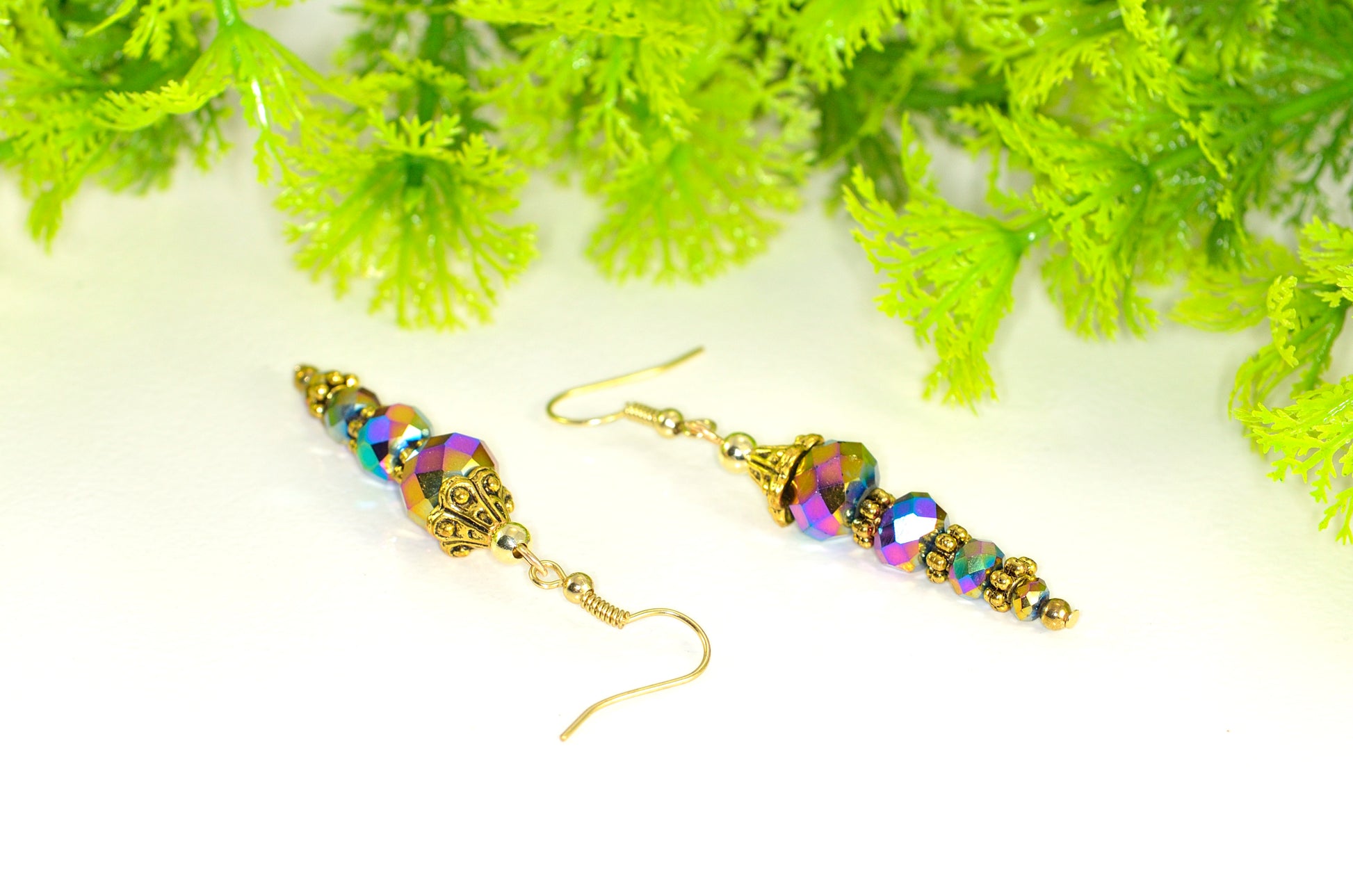 Close up of Sparkly Gold Glass Crystal Bead Earrings.