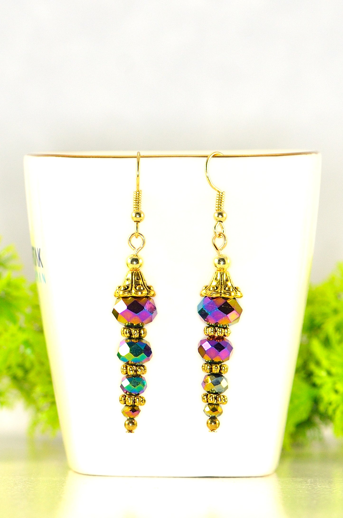 Close up of Sparkly Gold Glass Crystal Bead Earrings.