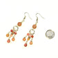 Statement Pink Rhodonite Chandelier Earrings beside a dime.
