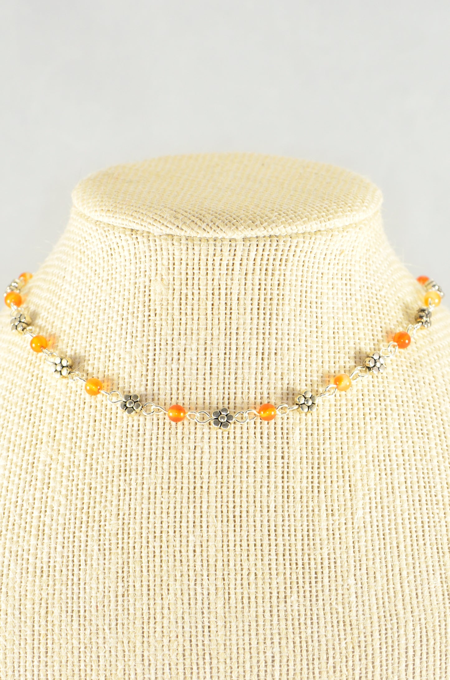 Close up of Tibetan Silver Flower and Carnelian Choker Necklace.