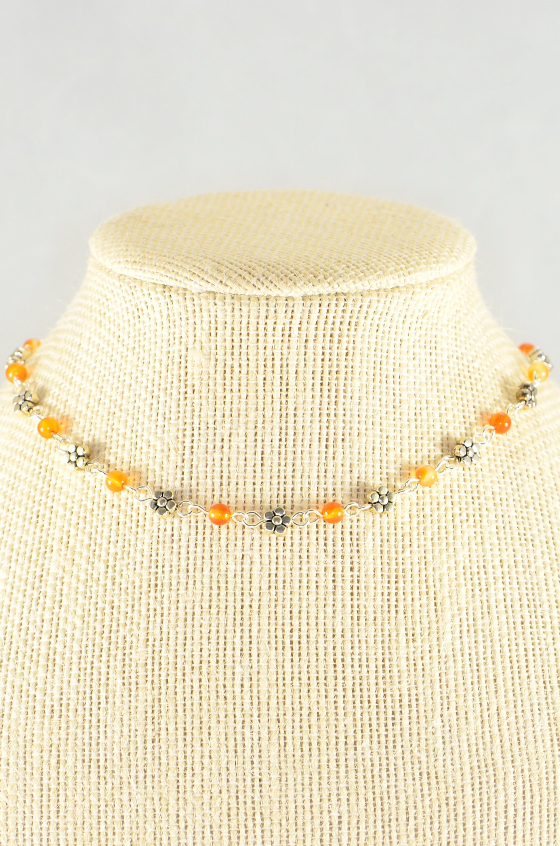 Close up of Tibetan Silver Flower and Carnelian Choker Necklace.